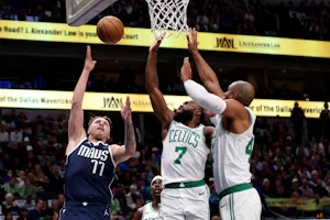 Luka Doncic of the Dallas Mavericks shoots the ball against Jaylen Brown and Al Horford of the Boston Celtics in the first half at American Airlines Center. We're backing Doncic in our Mavericks vs. Celtics Player Props.