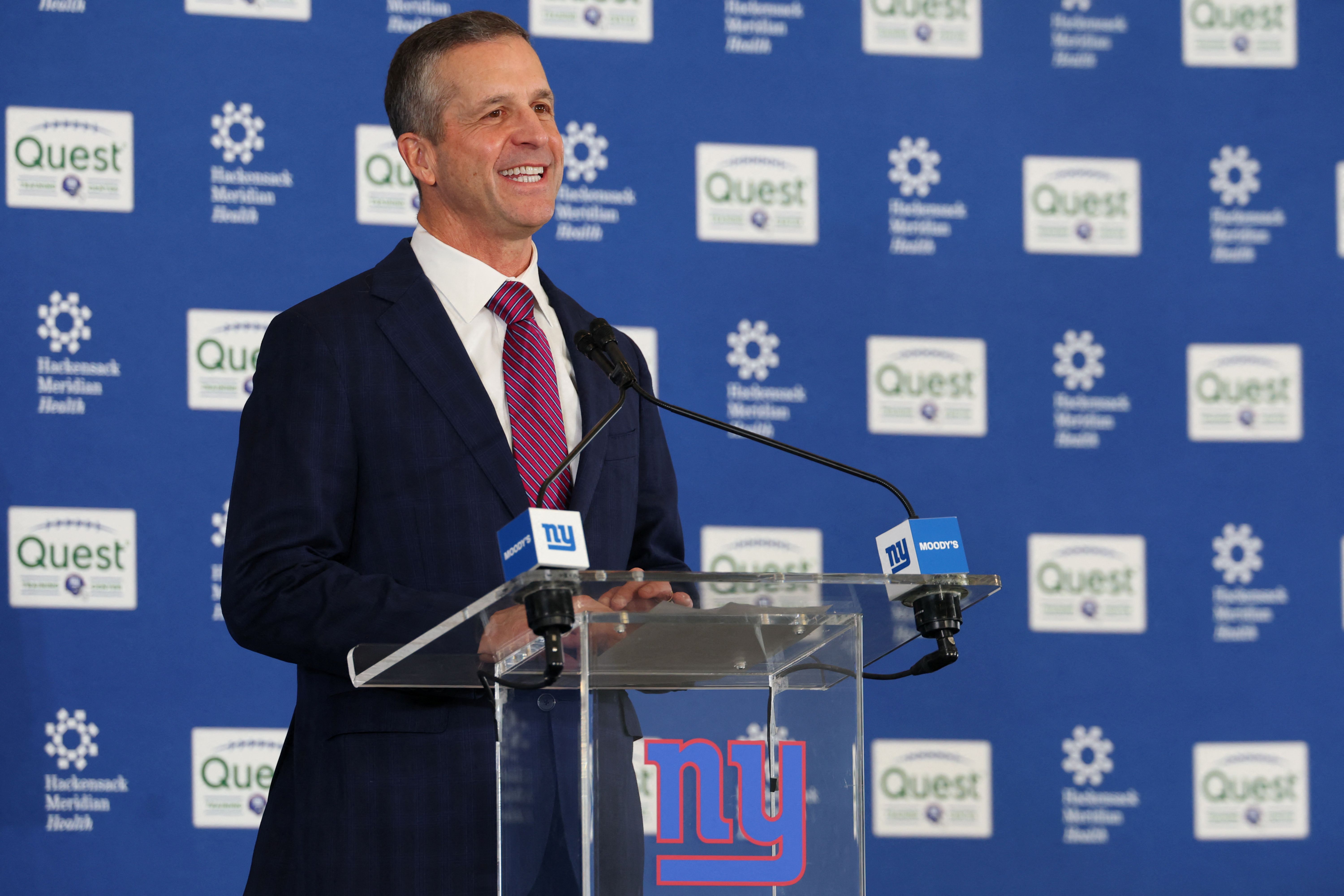 New York Giants head coach John Harbaugh speaks at the press conference, and he's the favorite in the opening NFL Coach of the Year odds.