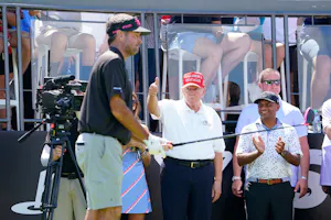 Former President Donald Trump gestures to the crowd as we look at the Trump vs. Biden golf challenge odds