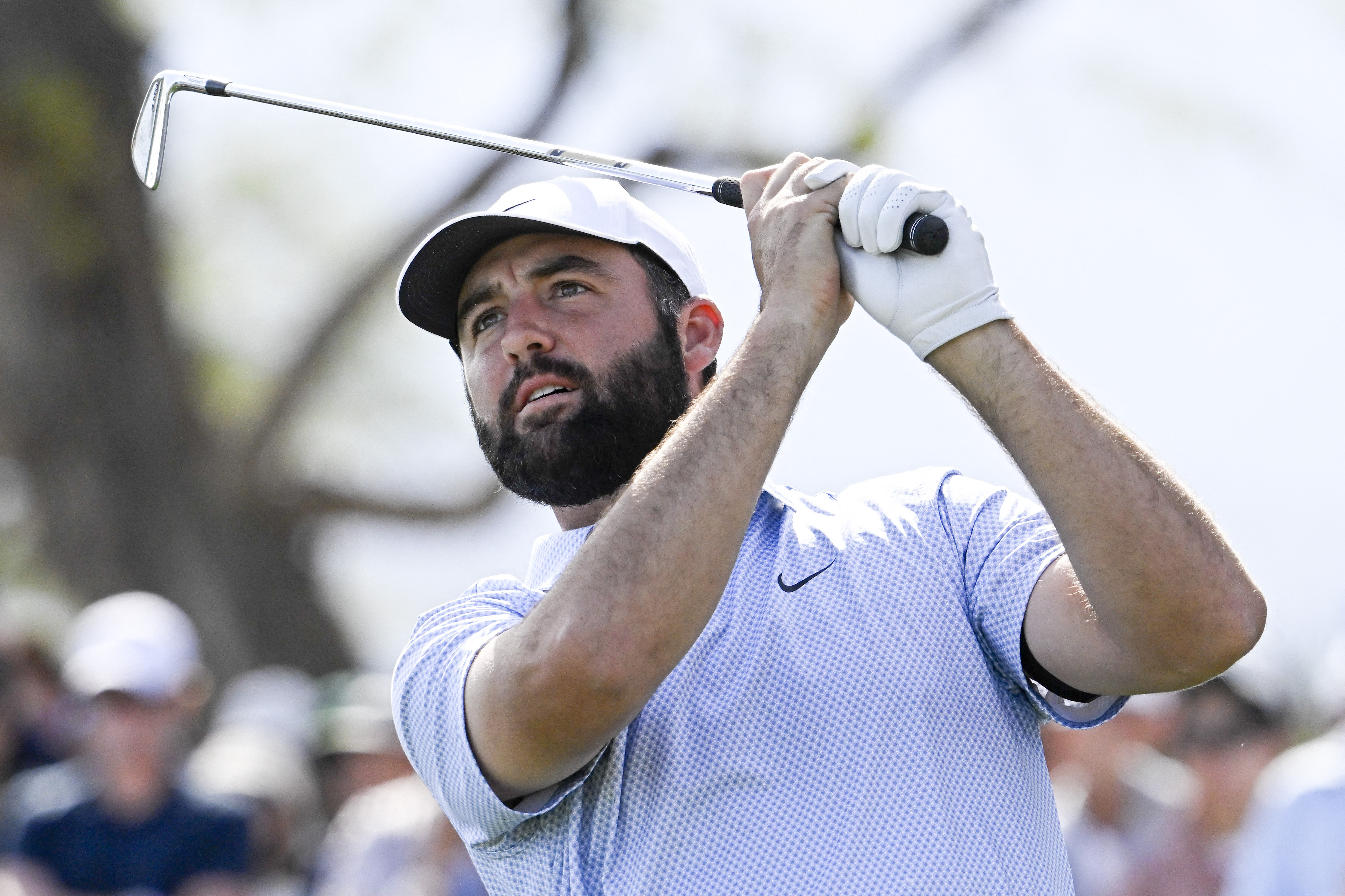 Scottie Scheffler hits his tee shot as we look at the WM Phoenix Open odds, favorites, and our pick to win