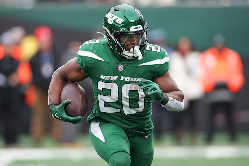 New York Jets running back Breece Hall carries the ball during the first half against the Washington Commanders at MetLife Stadium as we look at our Breece Hall TNF Player Prop Bets..