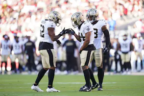 Linebacker D'Marco Jackson congratulates New Orleans Saints safety Johnathan Abram as we look at Louisiana's July sports betting financials.