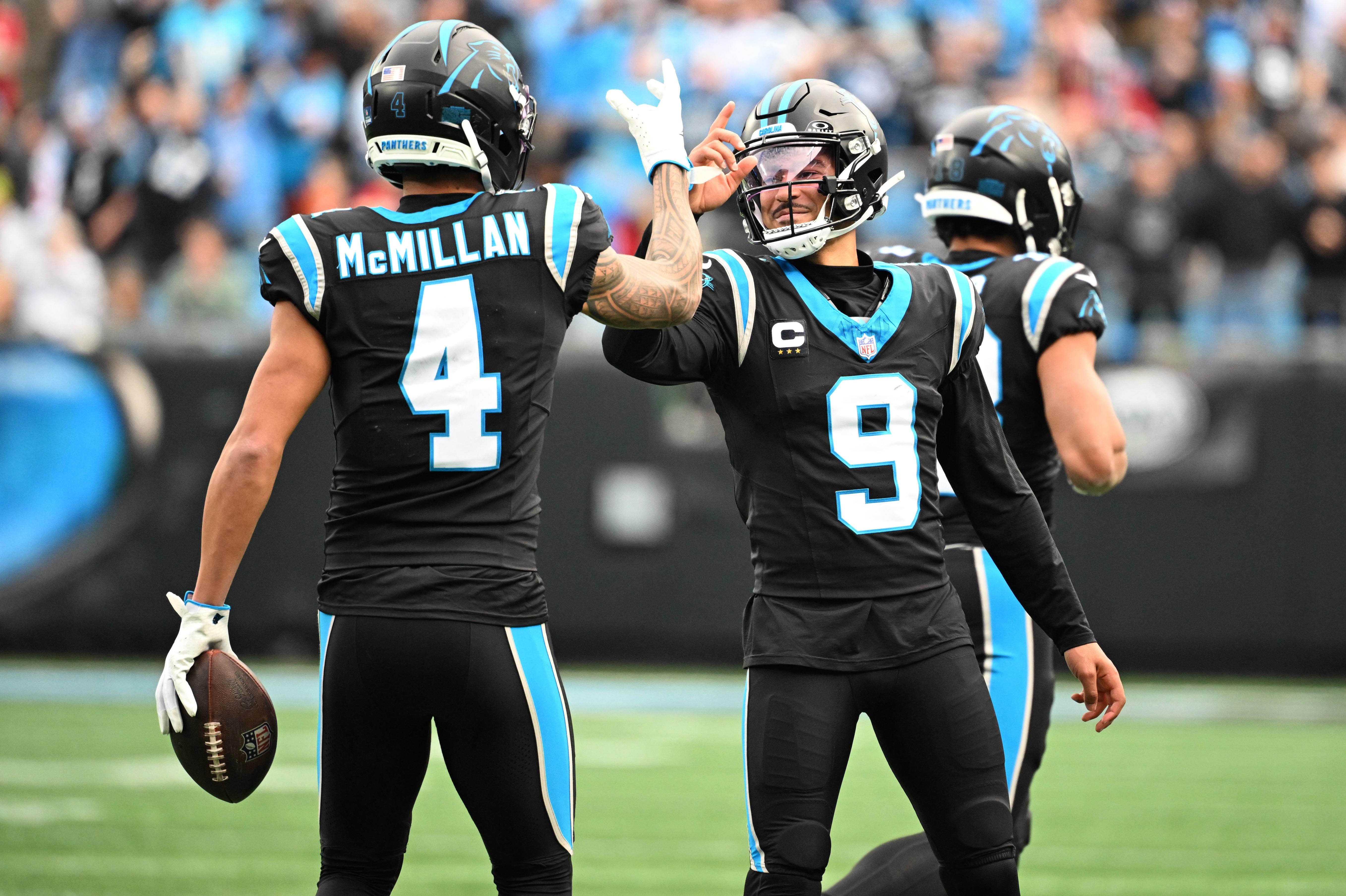 Carolina Panthers quarterback Bryce Young (9) celebrates with wide receiver Tetairoa McMillan (4) as we provide our Panthers vs. Browns prediction.