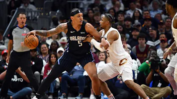 Paolo Banchero of the Orlando Magic posts up against Isaac Okoro of the Cleveland Cavaliers during the fourth quarter of game two of the Eastern Conference First Round Playoffs. We're backing Banchero in our Cavaliers vs. Magic player props & odds.