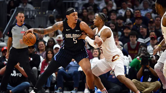 Paolo Banchero of the Orlando Magic posts up against Isaac Okoro of the Cleveland Cavaliers during the fourth quarter of game two of the Eastern Conference First Round Playoffs. We're backing Banchero in our Cavaliers vs. Magic player props & odds.