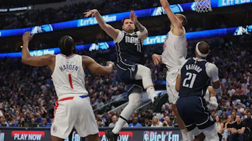 Luka Doncic of the Dallas Mavericks passes the ball while defended by Mason Plumlee and James Harden of the Los Angeles Clippers Game 4. We're backing Doncic in our Mavericks vs. Clippers player props. 