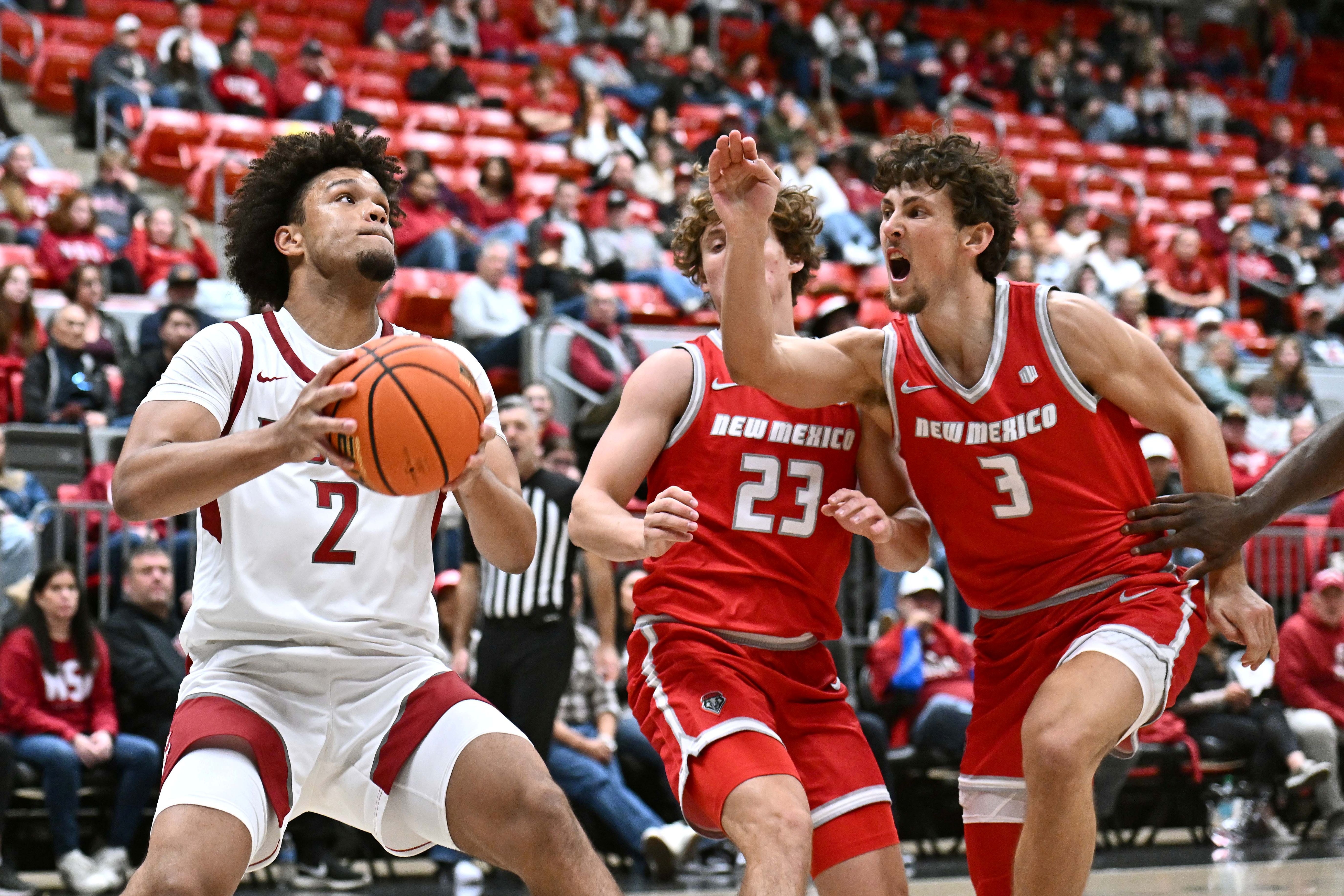 Washington State Cougars forward Eemeli Yalaho (2) shoots the ball against New Mexico Lobos guard Jake Hall (23).