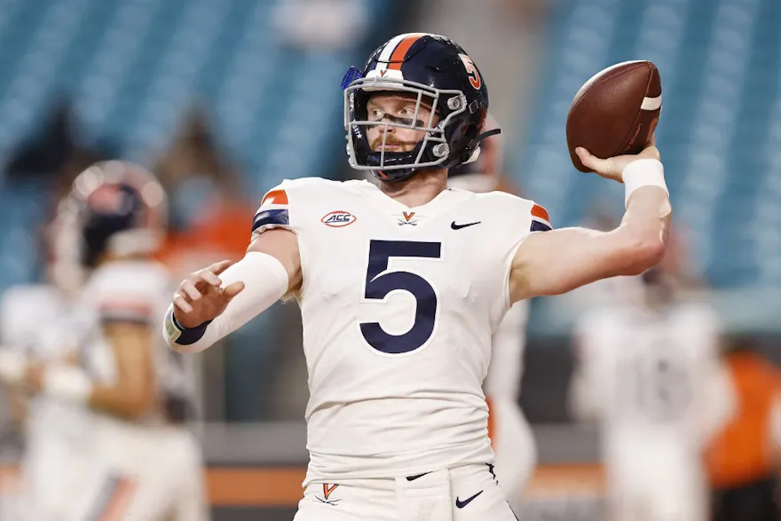 Brennan Armstrong of the Virginia Cavaliers warms up prior to the game against the Miami Hurricanes at Hard Rock Stadium.