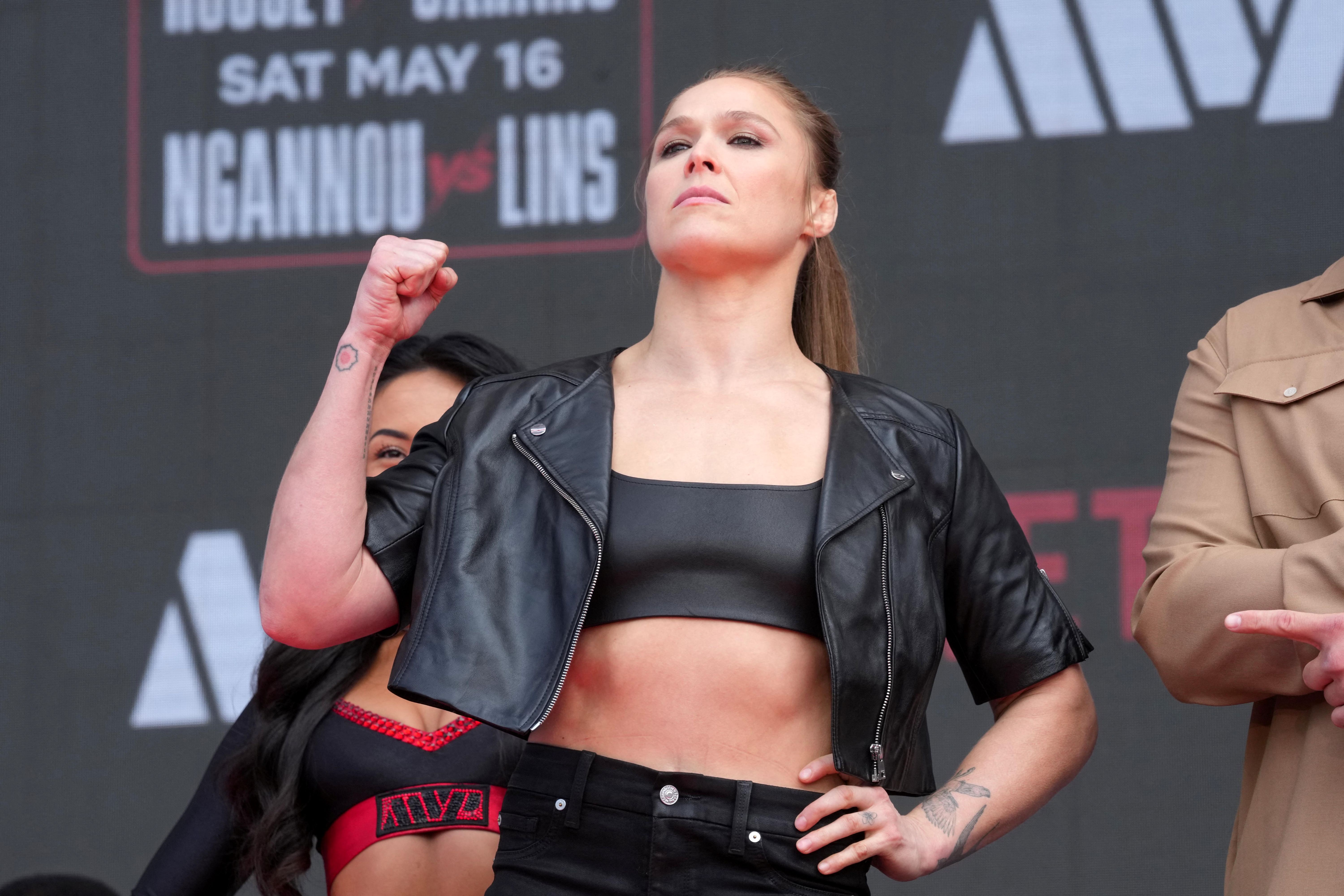 Ronda Rousey poses at a press conference as we make our early Rousey vs. Carano prediction.