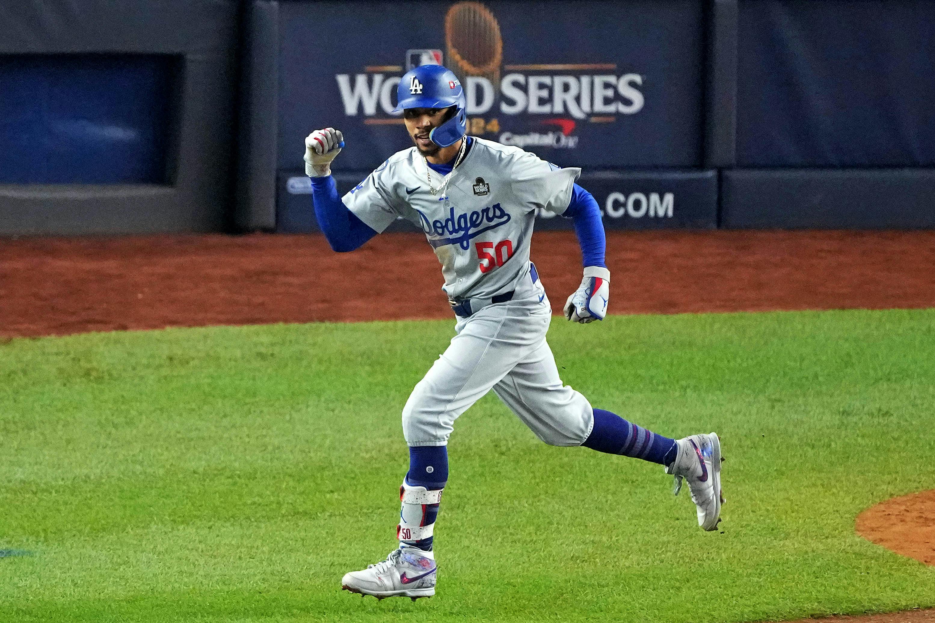 Los Angeles Dodgers shortstop Mookie Betts celebrates while running the bases as we look at the MLB MVP odds.