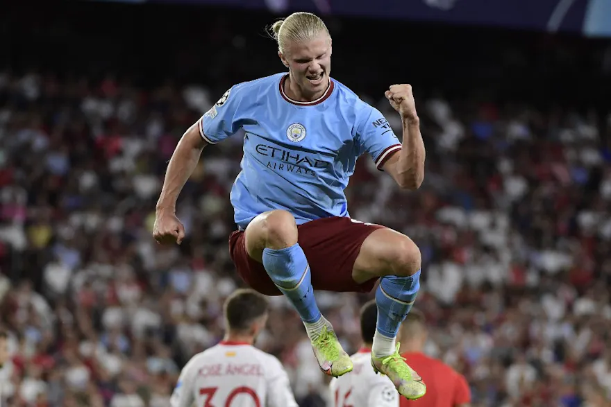 Manchester City striker Erling Haaland celebrates after scoring his team's third goal during the UEFA Champions League Group G first-leg football match against Sevilla FC, at the Ramon Sanchez Pizjuan stadium in Seville on September 6, 2022.