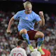 Manchester City striker Erling Haaland celebrates after scoring his team's third goal during the UEFA Champions League Group G first-leg football match against Sevilla FC, at the Ramon Sanchez Pizjuan stadium in Seville on September 6, 2022.