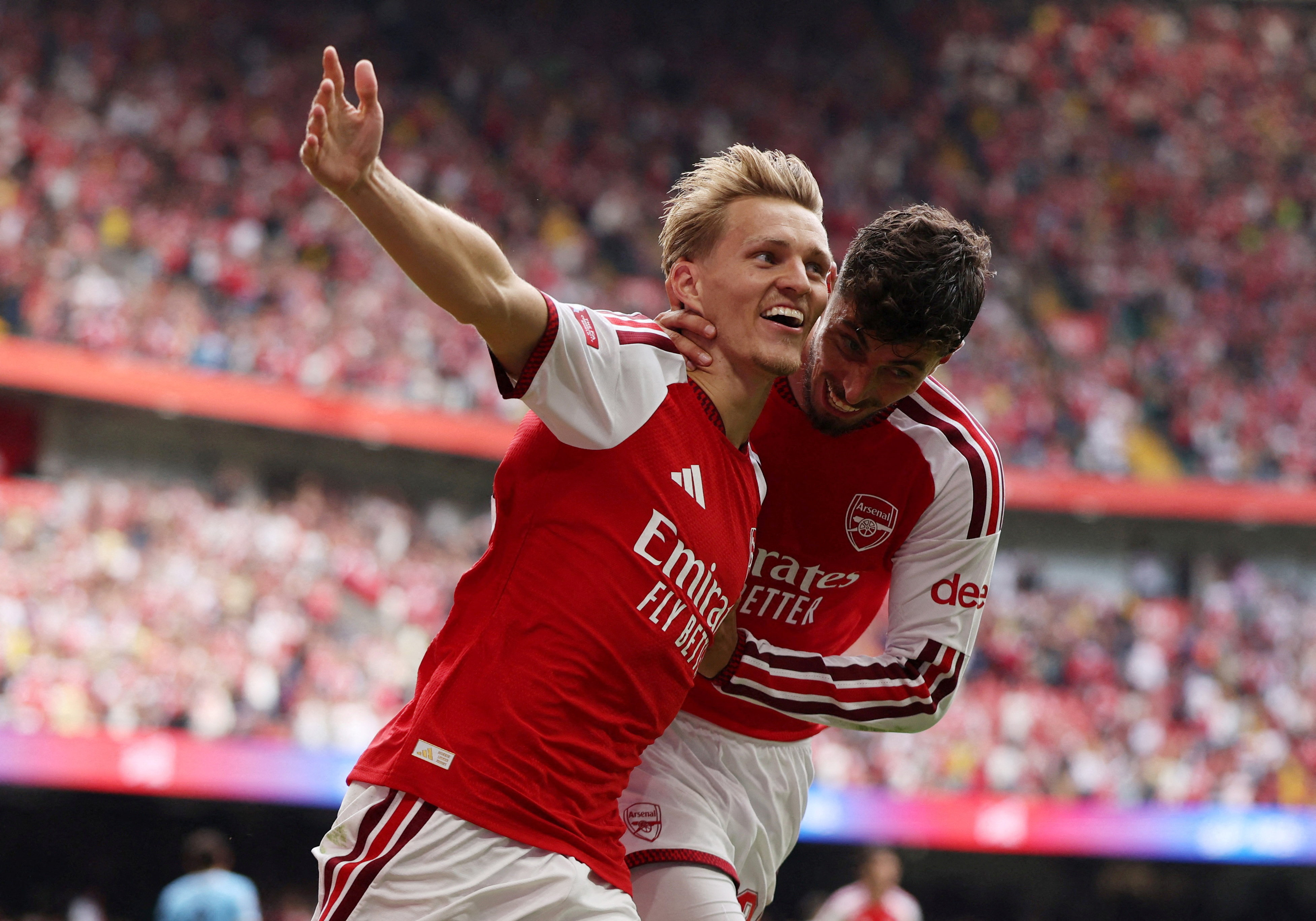 Arsenal's Martin Odegaard celebrates scoring with Kai Havertz as we make our best Arsenal vs. Coventry prediction