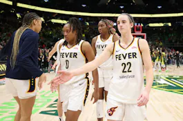 Caitlin Clark (22) of the Indiana Fever shakes hands with teammates, as we offer our best Fever vs. Sparks prediction and expert picks for Friday's game at Crypto.com Arena in Los Angeles.
