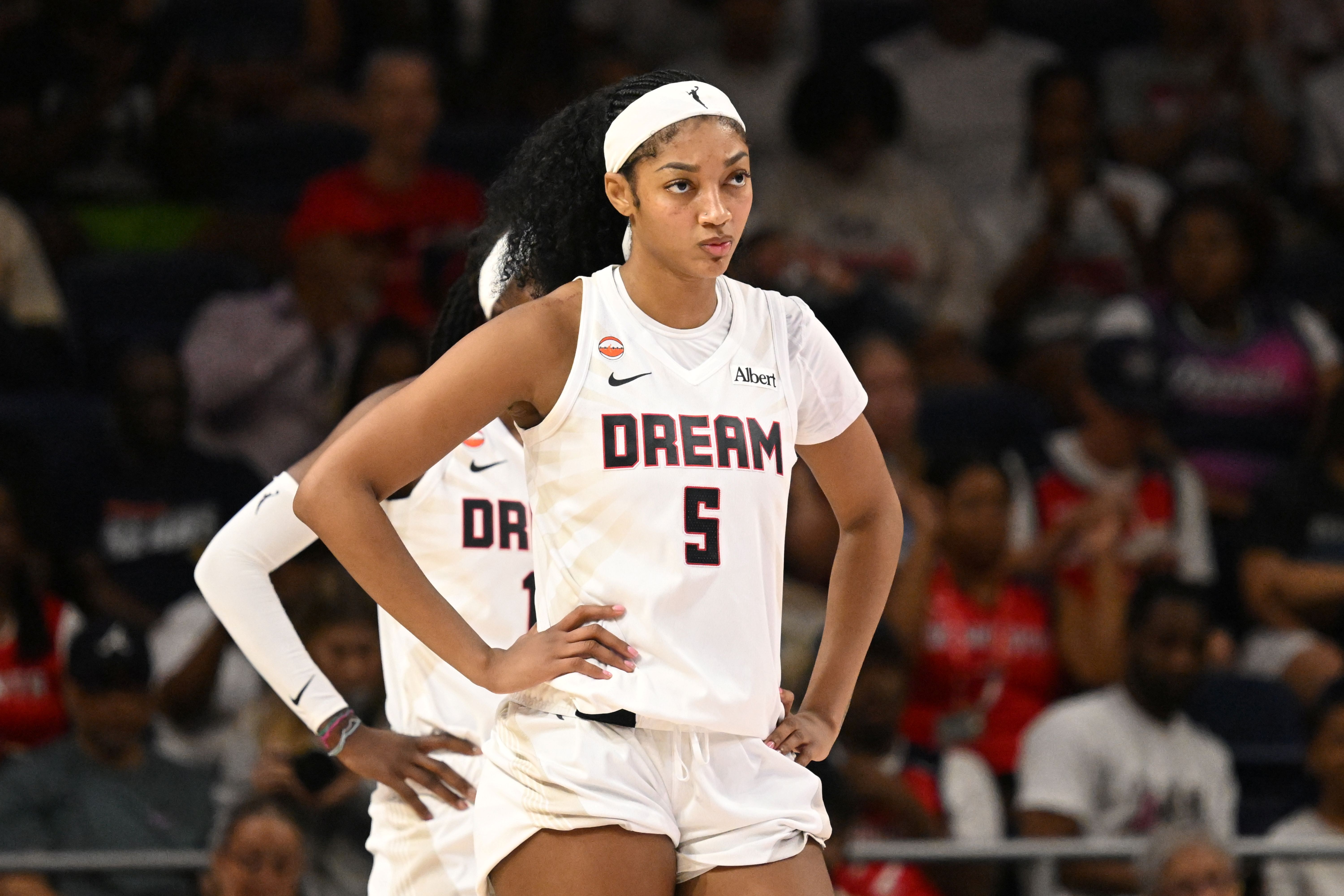 Atlanta Dream forward Angel Reese waits for play to start, and she's featured in my Valkyries Vs Dream Prediction.