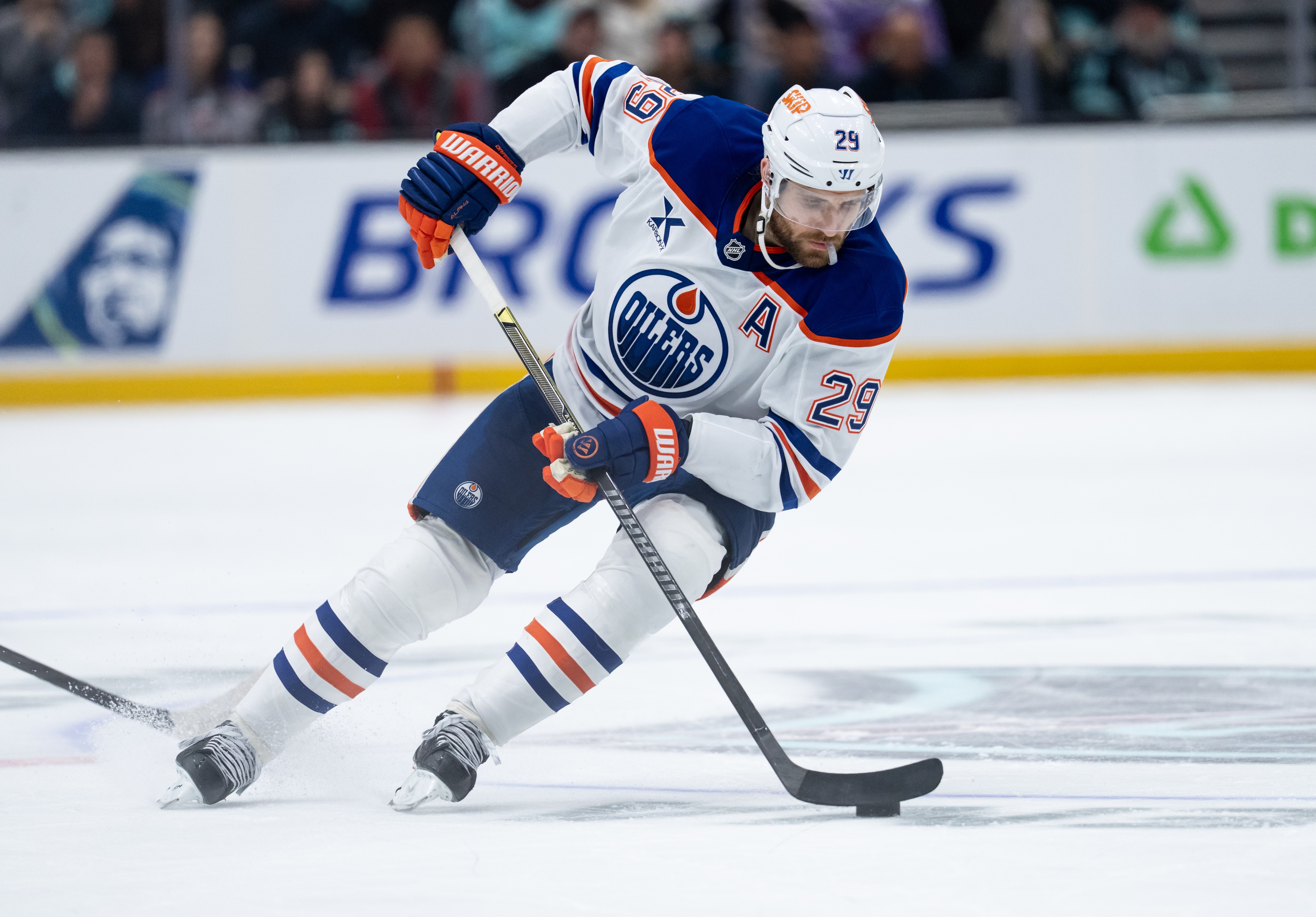 Edmonton Oilers forward Leon Draisaitl (29) skates with the puck as we offer our NHL anytime goal scorer predictions today.