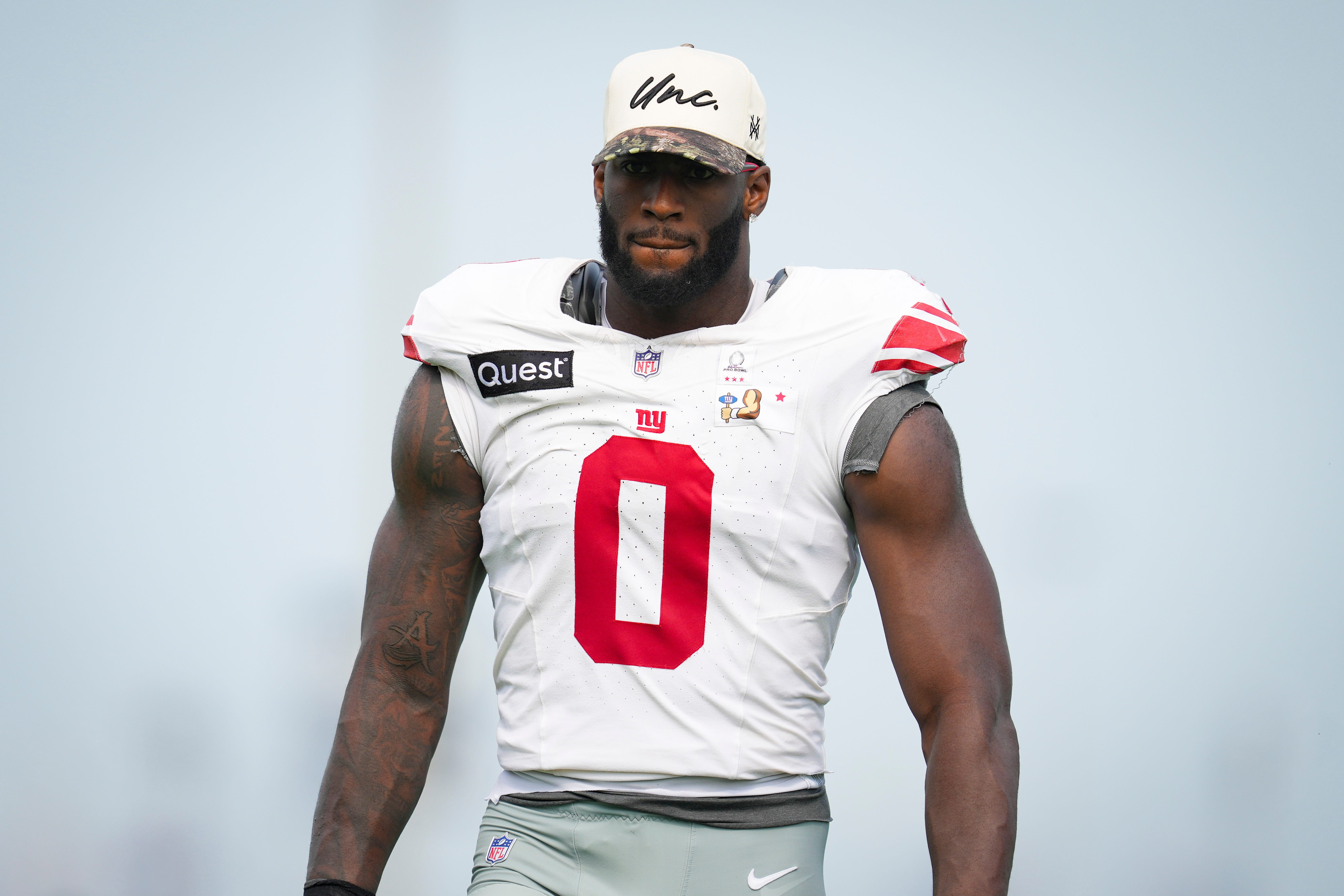 New York Giants linebacker Brian Burns (0) walks of the field as we break down our NFL best bets for preseason Week 1.