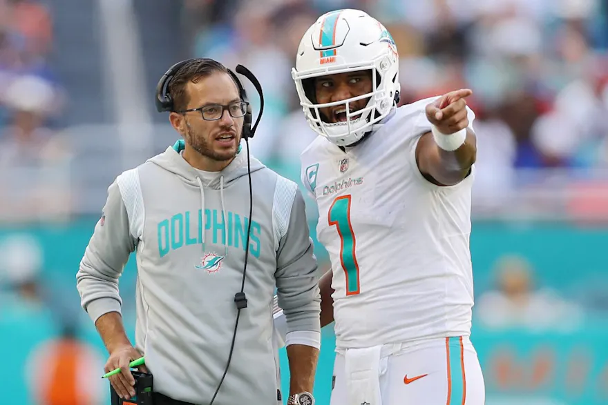 Head coach Mike McDaniel speaks with quarterback Tua Tagovailoa of the Miami Dolphins in the fourth quarter of the game against the Buffalo Bills, and we offer our top SGP predictions for Dolphins vs. Eagles based on the best NFL odds.