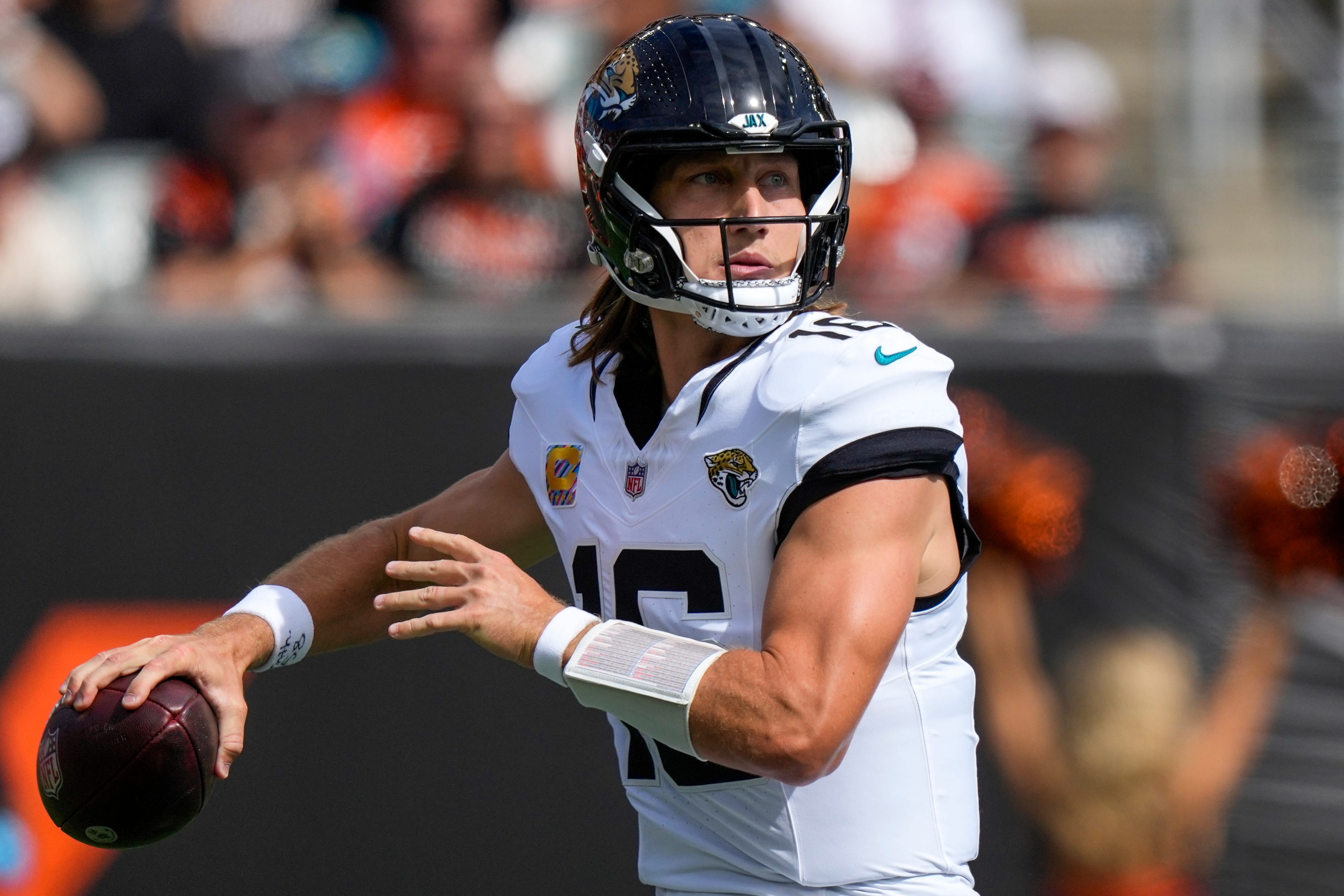 Pictured: Jaguars quarterback Trevor Lawrence throwing a pass as we break down our NFL AI Predictions: Week 5 ATS Picks & Score Projections for Every Matchup. Photo by USA TODAY Network via Reuters Connect.