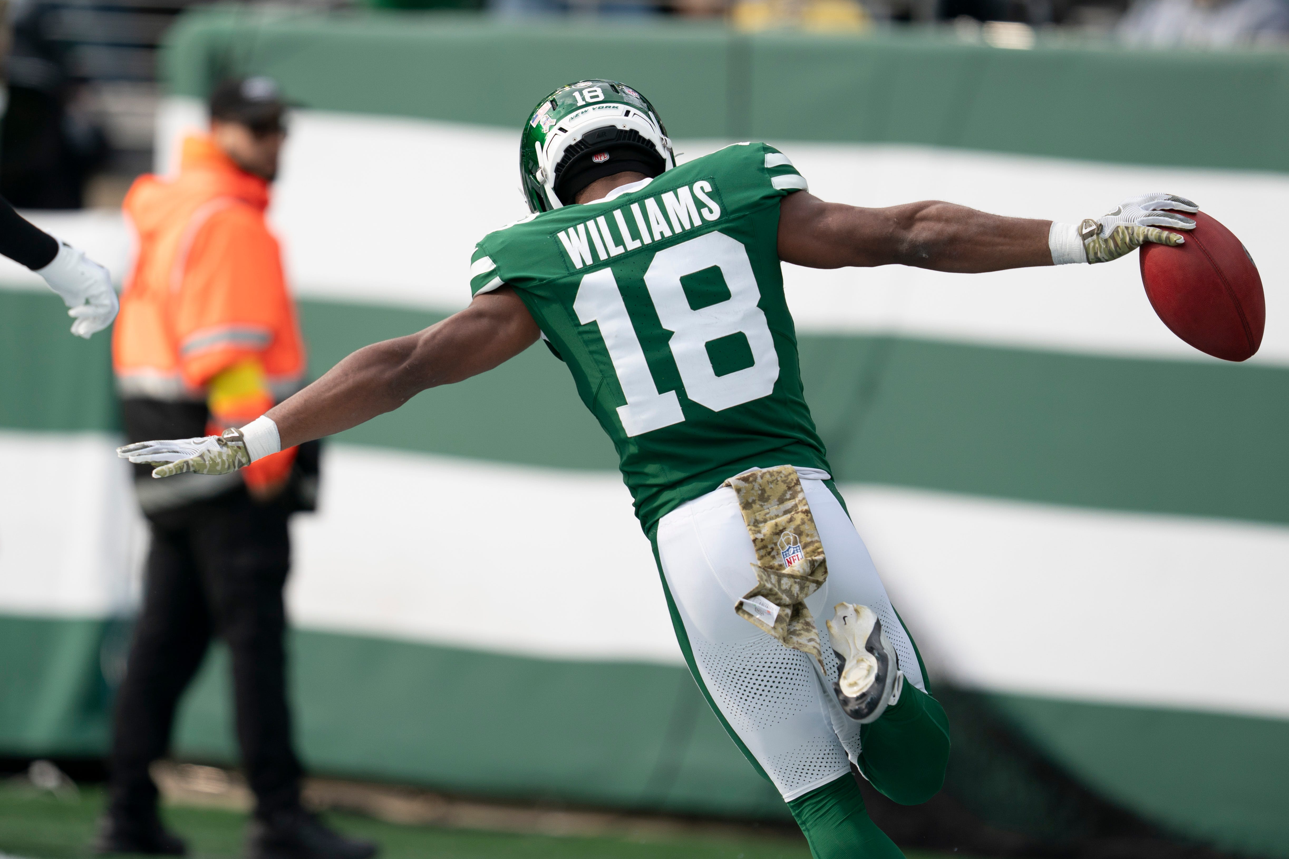New York Jets wide receiver Isaiah Williams celebrates after scoring a touchdown as we look at the New York online sports betting handle record.