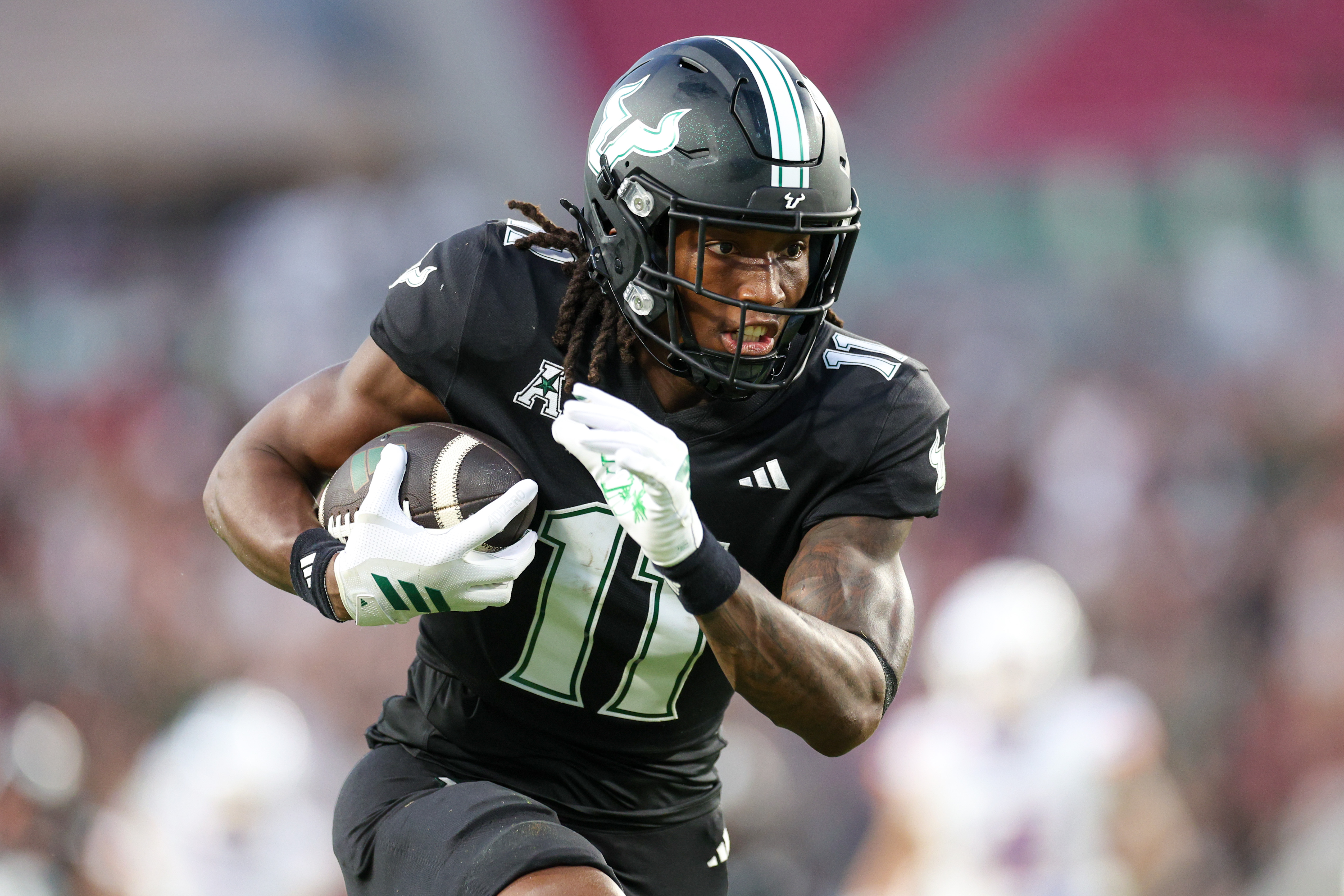 South Florida Bulls wide receiver Keshaun Singleton (11), seen here running into the end zone, is featured in our Old Dominion vs. South Florida predictions for the 2025 Cure Bowl.