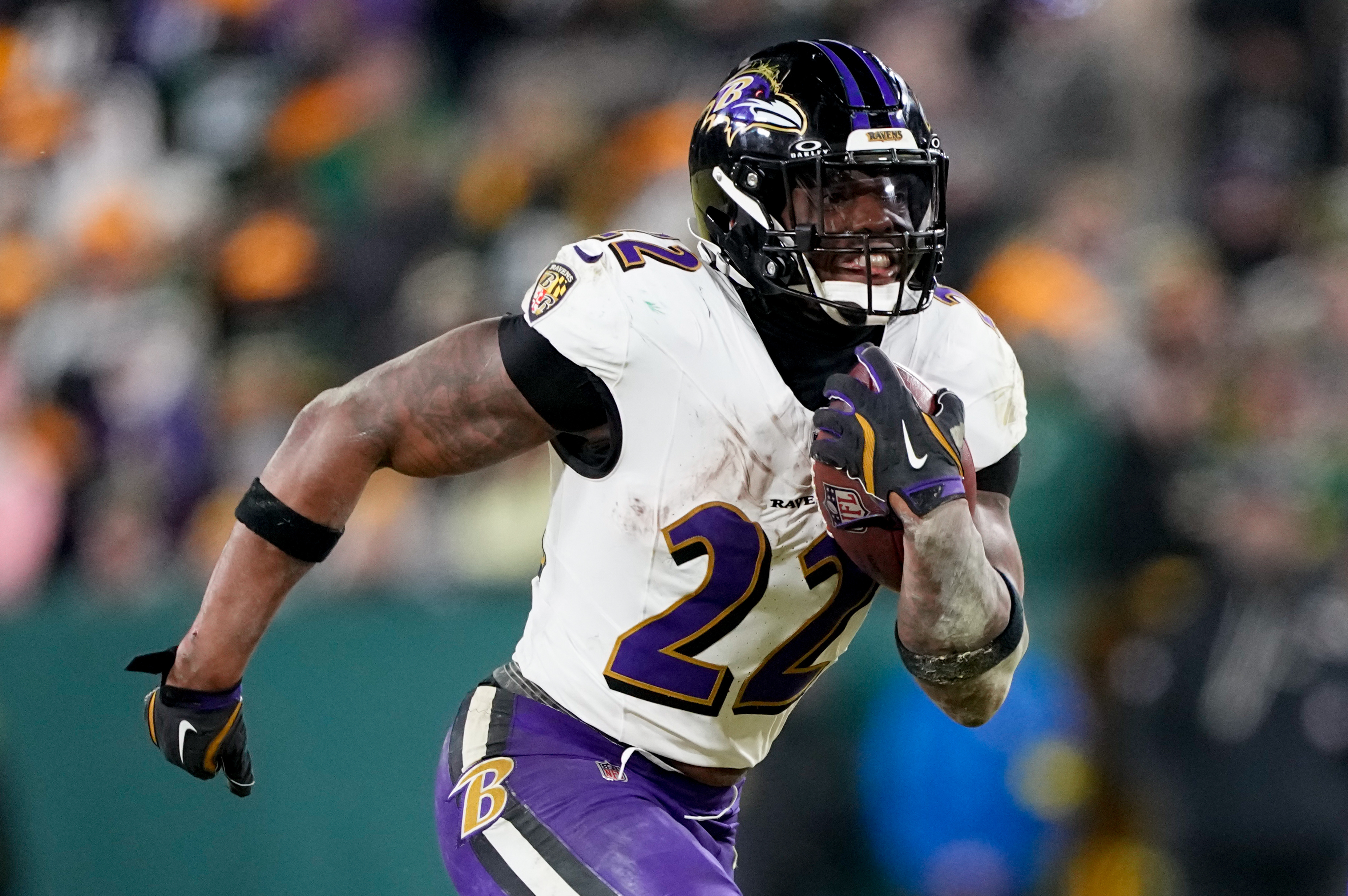 Baltimore Ravens running back Derrick Henry (22) runs as we offer our NFL AI predictions for Week 18.