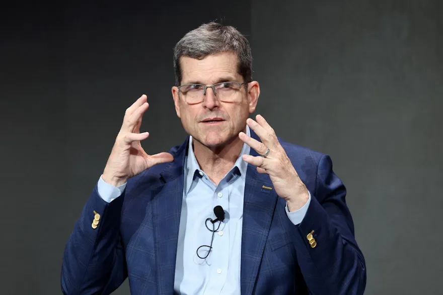 Jim Harbaugh speaks onstage during Verizon’s press conference as we look at the best 2024-25 NFL Coach of the Year award odds