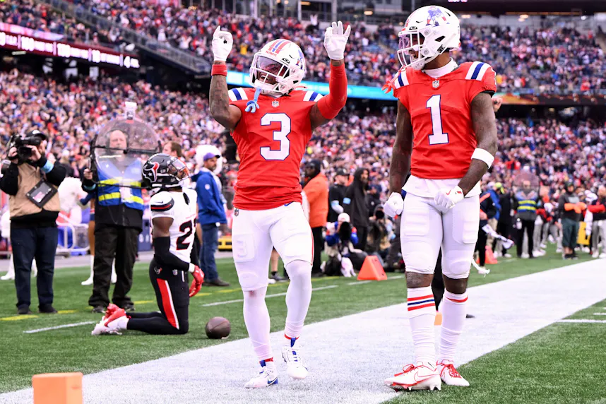 New England Patriots wide receiver DeMario Douglas celebrates with Ja'Lynn Polk after scoring a touchdown against the Houston Texans.