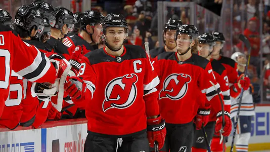 Nico Hischier of the New Jersey Devils in action against the Edmonton Oilers and we offer our top odds and predictions for Devils vs. Sabres on Friday.