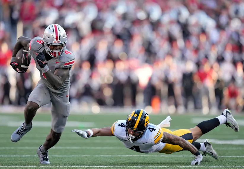 Ohio State wide receiver Jeremiah Smith gets past Iowa defensive back Koen Entringer. We're backing Smith in our Ohio State vs. Oregon prediction.