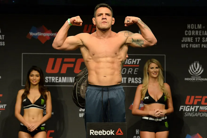 Rafael dos Anjos of Brazil stands on a weighing scale during the UFC Fight Night official weigh-in in Singapore as we look at the UFC Fight Night BetMGM promo.