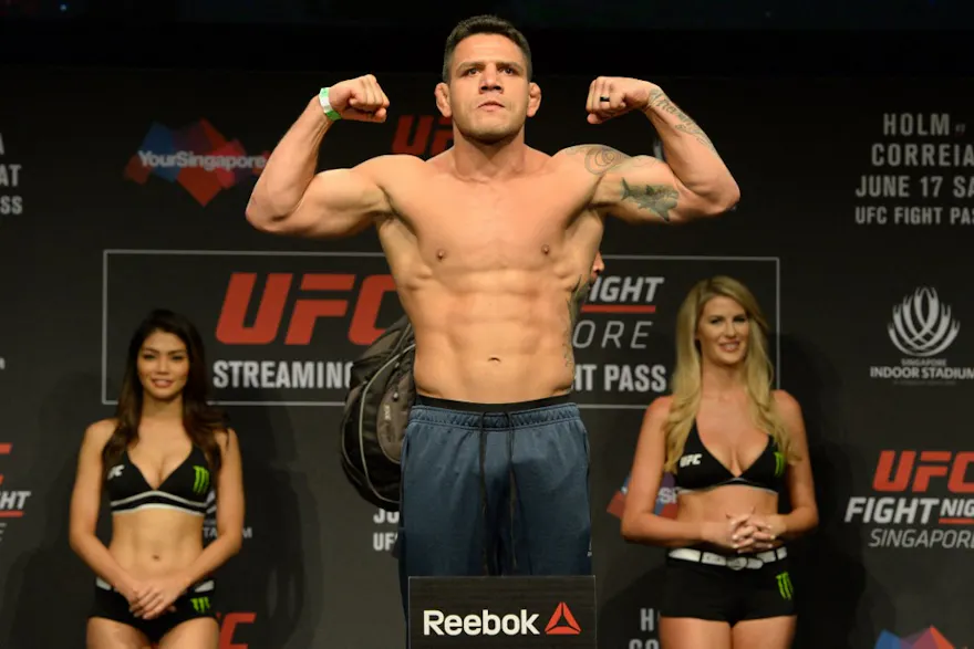 Rafael dos Anjos of Brazil stands on a weighing scale during the UFC Fight Night official weigh-in in Singapore as we look at the UFC Fight Night BetMGM promo.