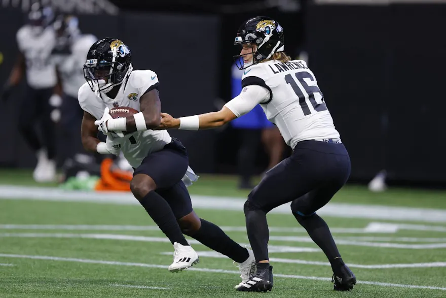 Jacksonville Jaguars quarterback Trevor Lawrence hands off to running back Travis Etienne Jr. against the Atlanta Falcons. 