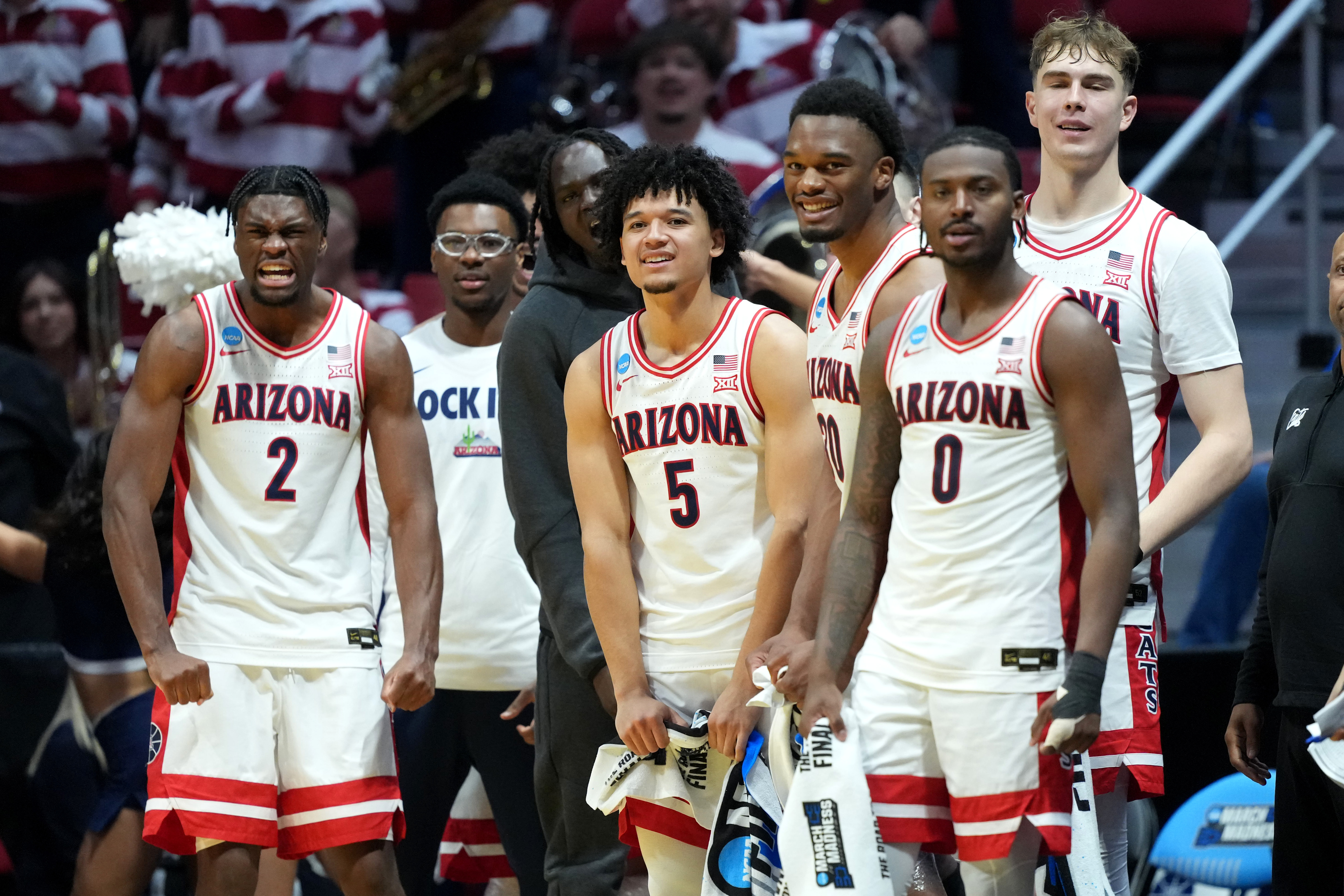 Wildcats' players celebrate as we offer our Utah State vs. Arizona prediction and parlay. 