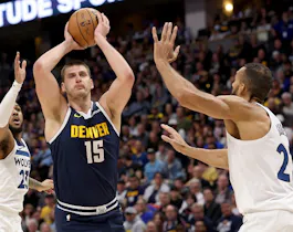 Nikola Jokic (15) of the Denver Nuggets goes to the basket as we offer our best Timberwolves vs. Nuggets player props for Game 1 on Saturday at Ball Arena in Denver.