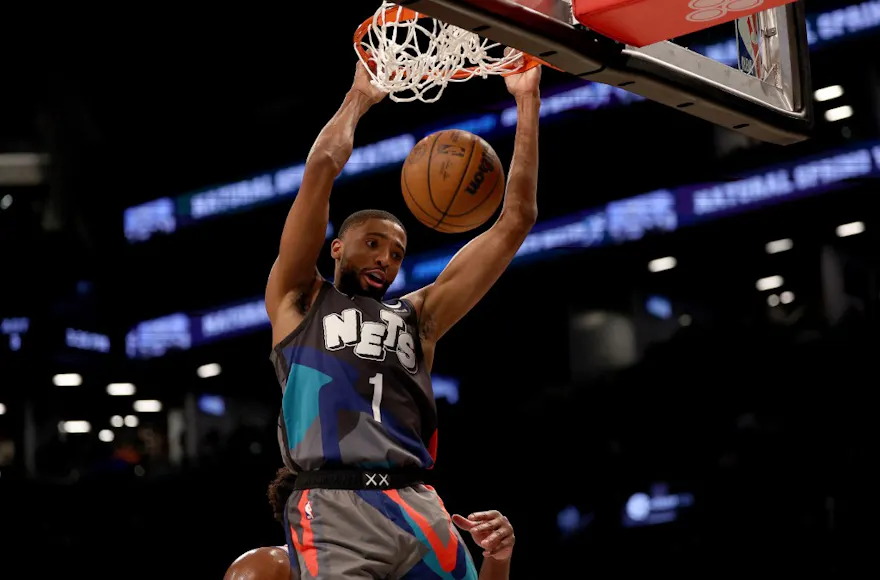 Mikal Bridges of the Brooklyn Nets dunks over Joel Embiid of the Philadelphia 76ers as we share our best Knicks vs. Nets bonus code.