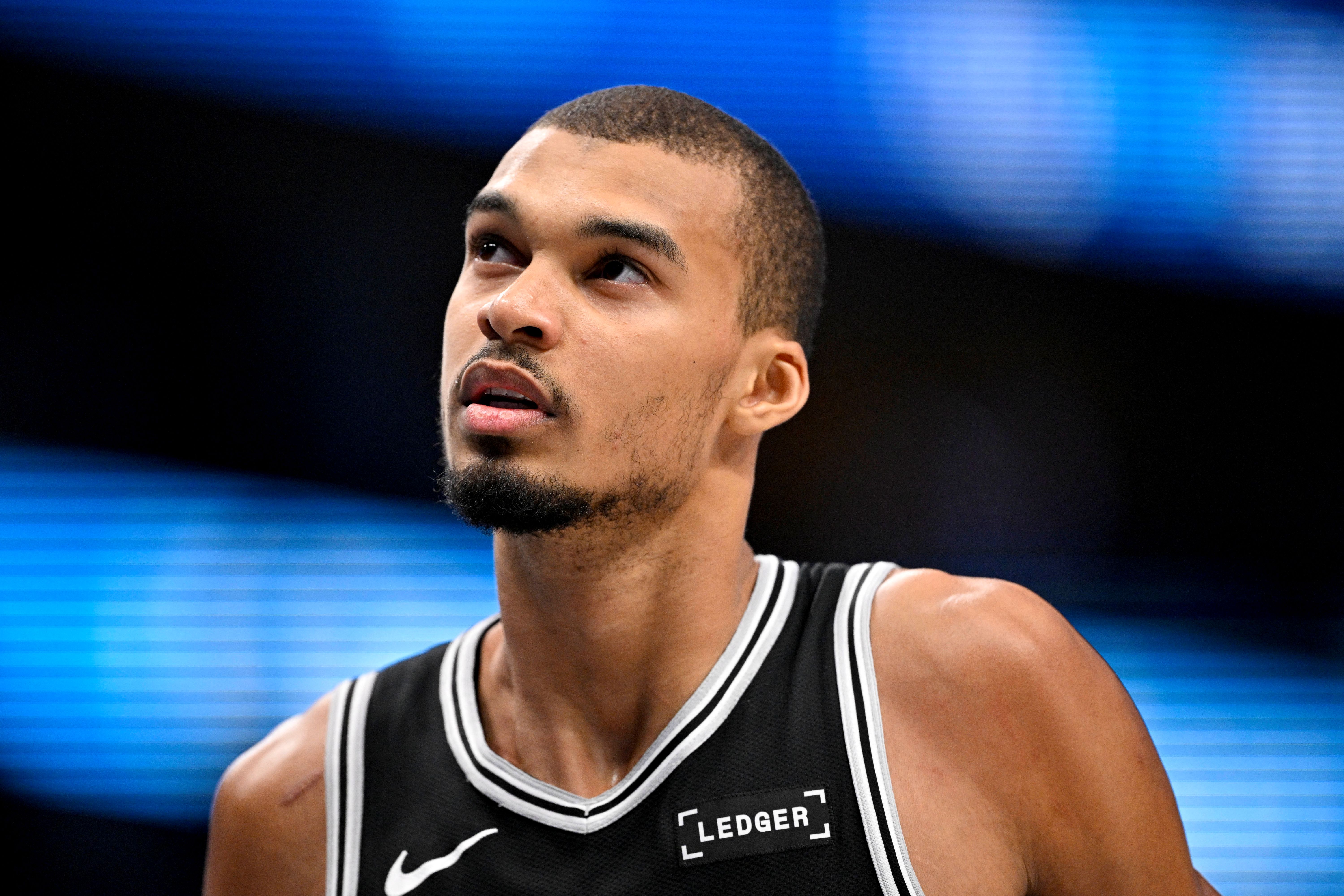 San Antonio Spurs forward Victor Wembanyama (1), seen here looking on during a game, is featured in our Clippers vs. Spurs player props tonight.