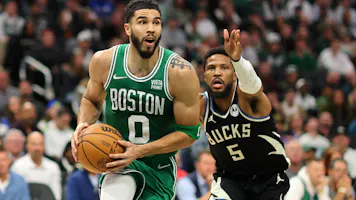 Jayson Tatum of the Boston Celtics drives around Malik Beasley of the Milwaukee Bucks during the second half of a game at Fiserv Forum. Tatum is the favorite by the 2024 NBA Finals MVP odds. 