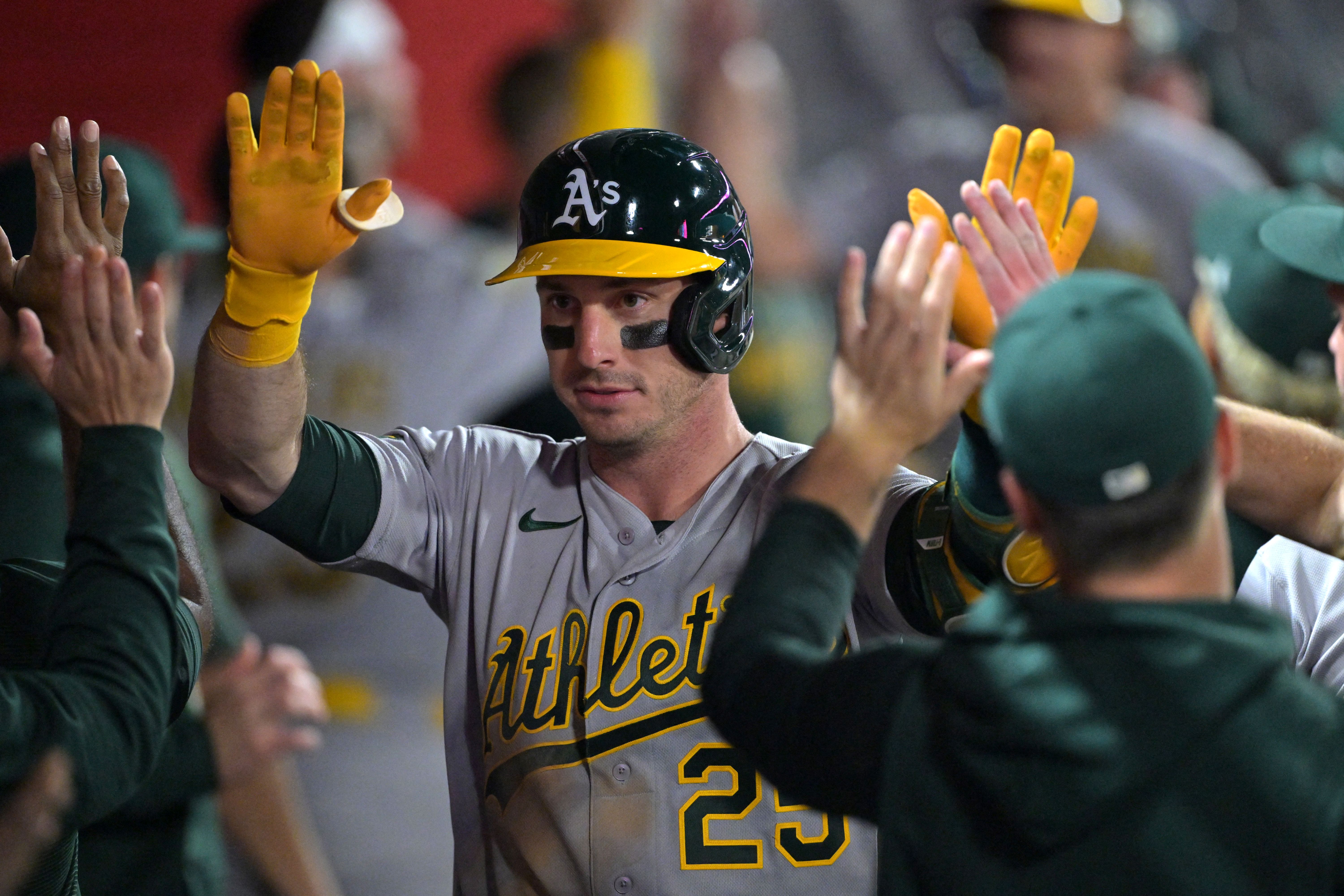 Athletics designated hitter Brent Rooker (25) is greeted in the dugout as we break down our home run predictions today.