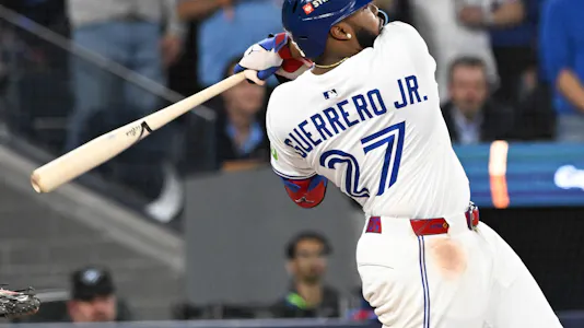 Toronto Blue Jays first baseman Vladimir Guerrero Jr. (27) hits a single as we break down our Vladimir Guerrero Jr. player prop bets for World Series Game 3.