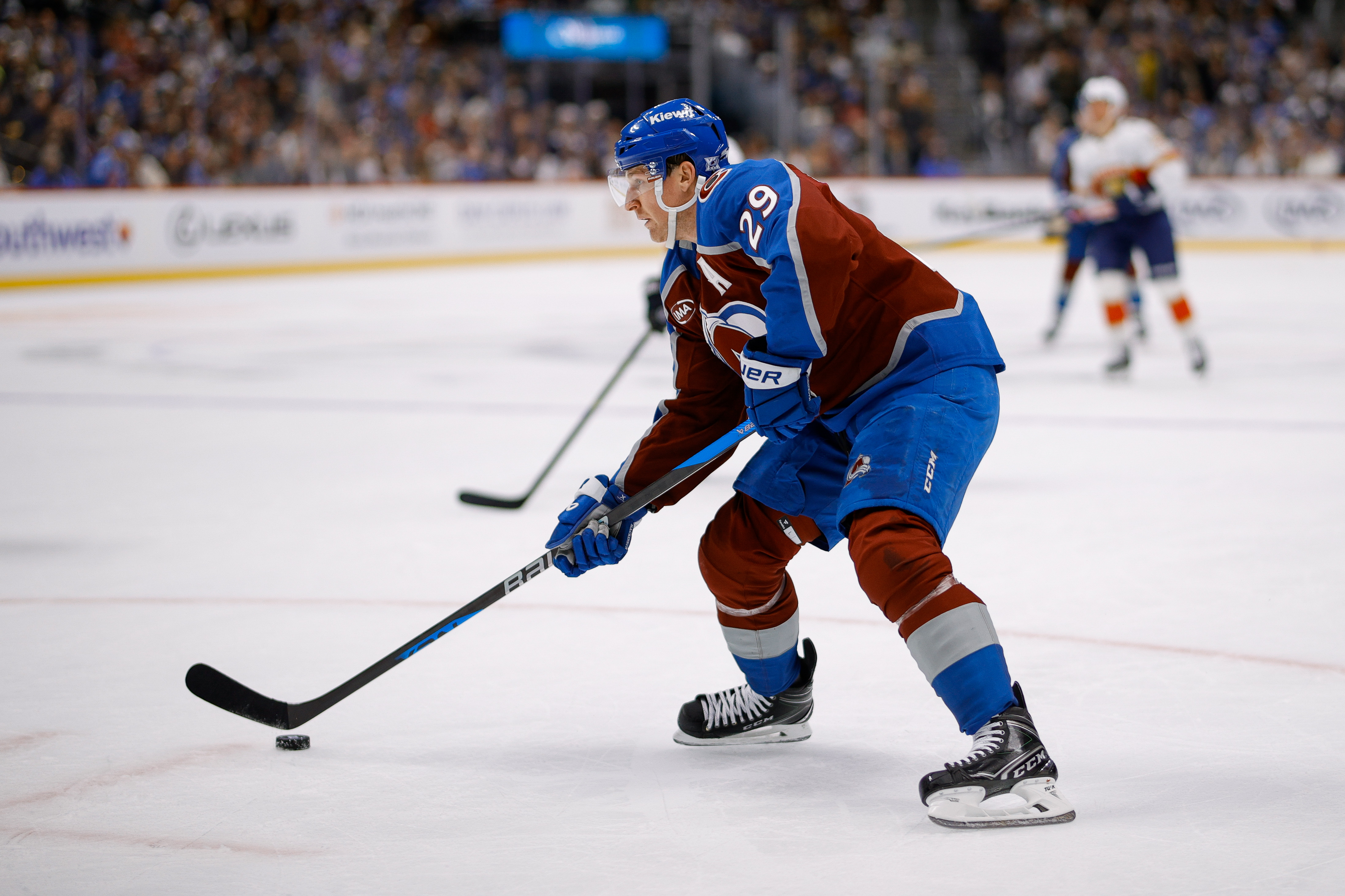 Colorado Avalanche center Nathan MacKinnon (29) controls the puck as part of our Avalanche vs. Kraken player props.