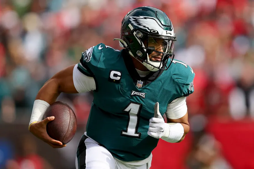 Jalen Hurts of the Philadelphia Eagles runs with the ball against the Tampa Bay Buccaneers during the first quarter in the NFC Wild Card Playoff game at Raymond James Stadium in Tampa, Florida. Photo by Michael Reaves/Getty Images via AFP.