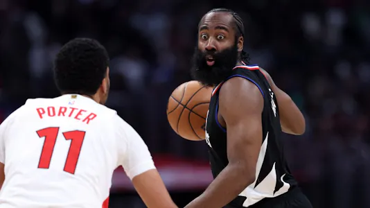 James Harden of the LA Clippers looks to pass as Jontay Porter of the Toronto Raptors defends during the second half of a game at Crypto.com Arena. Porter received a lifetime ban from the NBA following an investigation.
