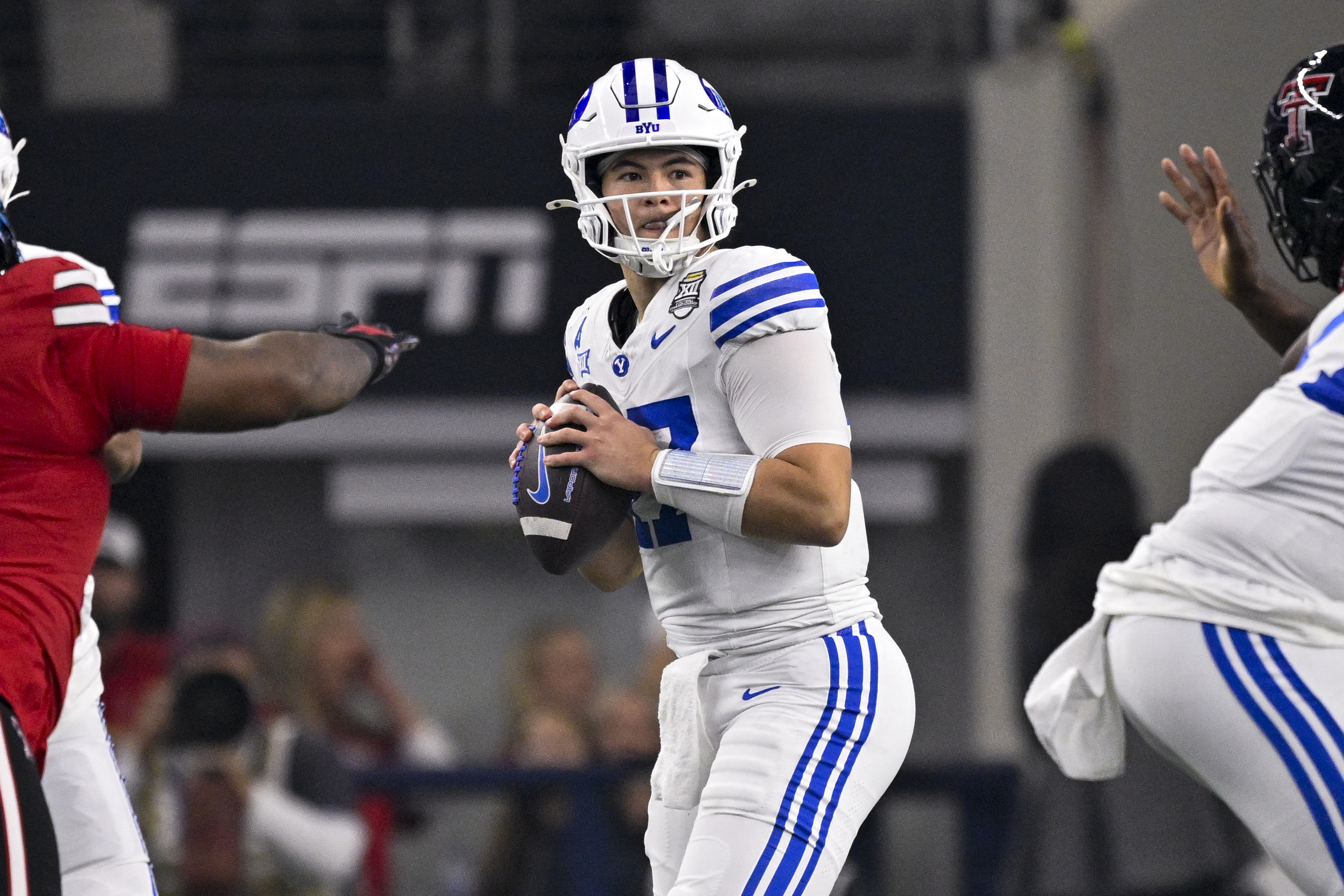 BYU Cougars quarterback Bear Bachmeier (47) looks to throw as he is featured in our Georgia Tech vs. BYU player props for Pop-Tarts Bowl.