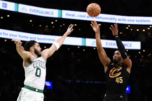 Donovan Mitchell (45) of the Cleveland Cavaliers shoots the ball against Jayson Tatum (0) of the Boston Celtics, as we offer our best Celtics vs. Cavaliers player props for Game 3 on Saturday at Rocket Mortgage FieldHouse in Cleveland.