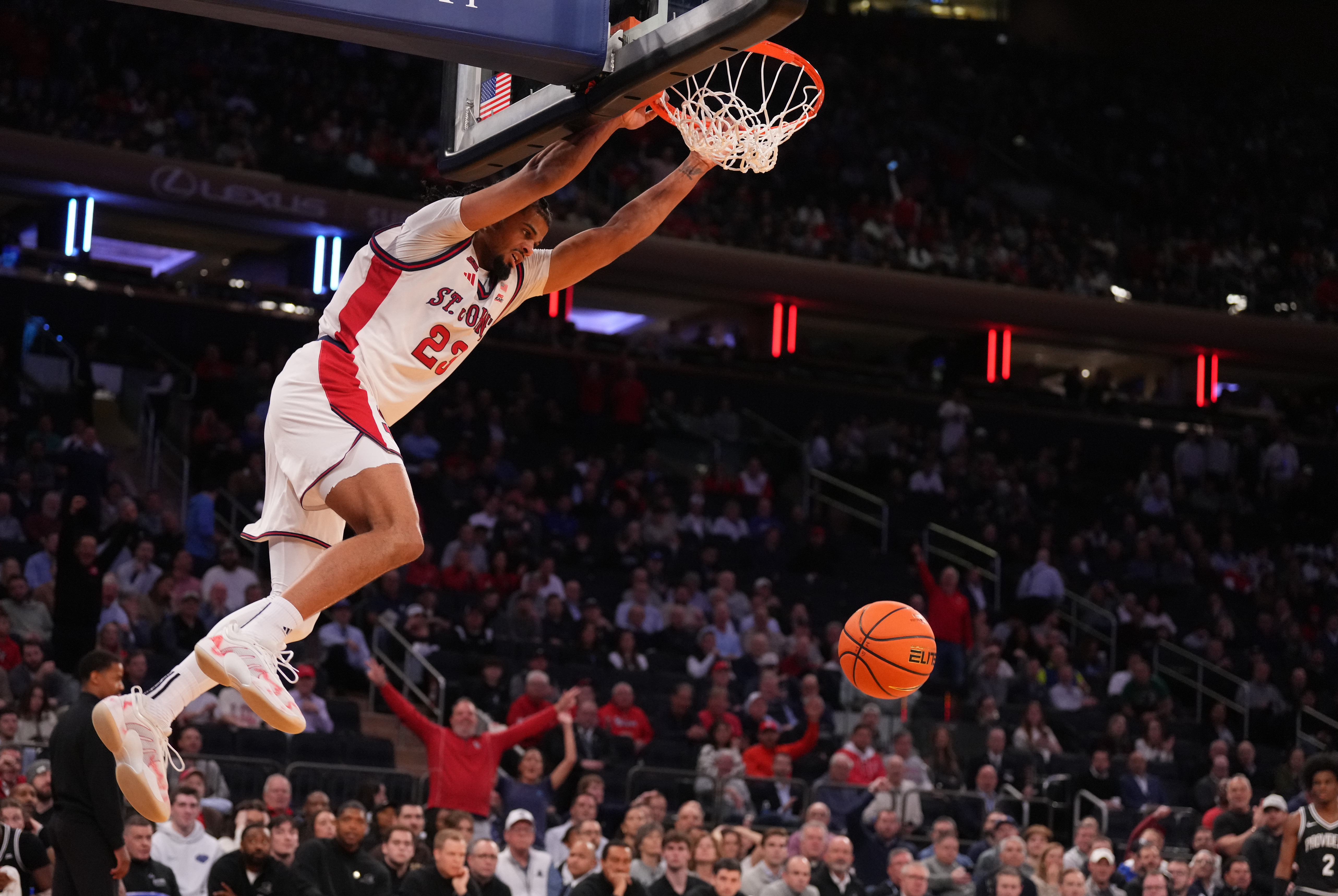 St. John's Red Storm forward Bryce Hopkins dunks as we make our best UConn vs. St. John's prediction.
