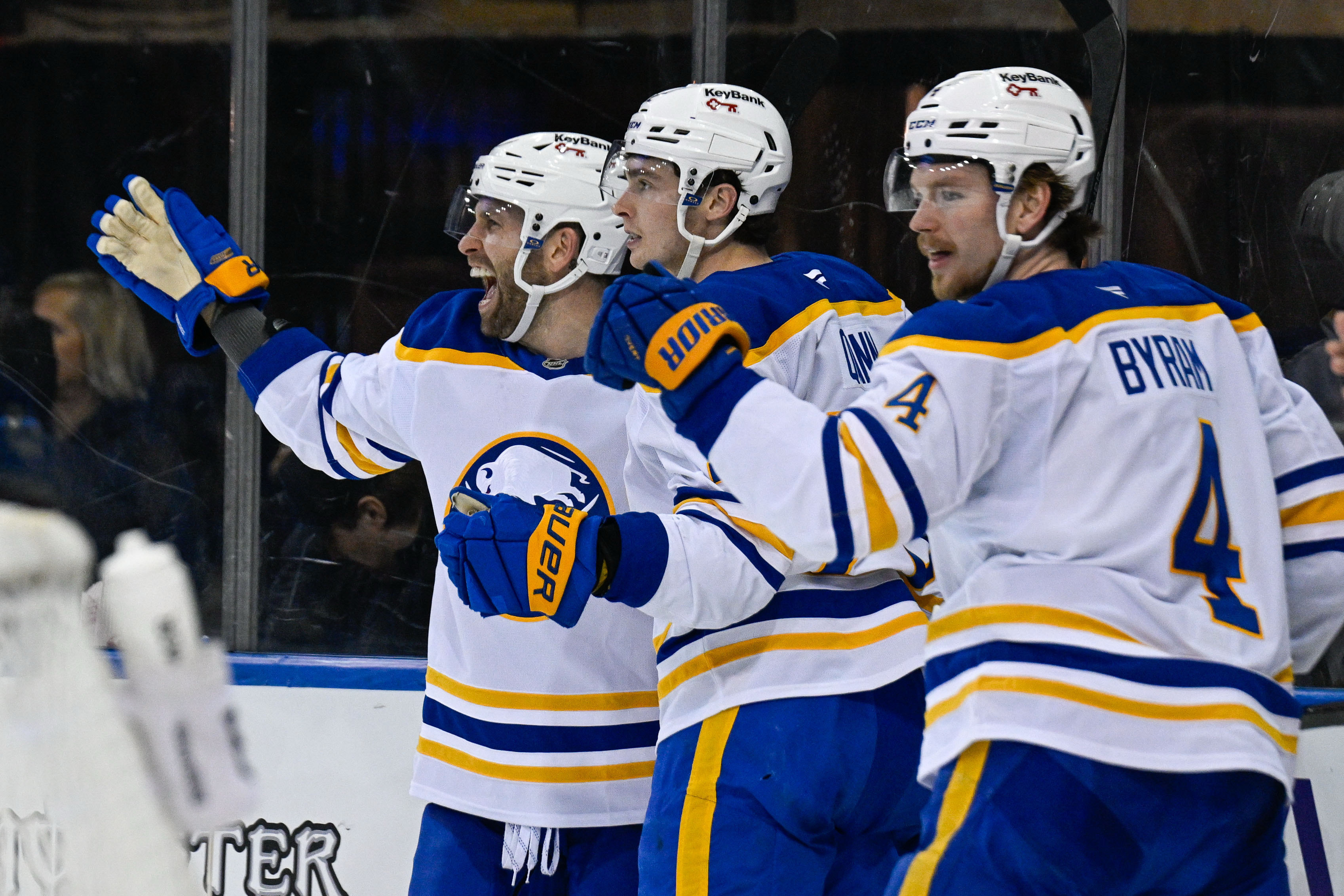 Buffalo Sabres right wing Jack Quinn (22) and defenseman Bowen Byram (4) celebrate the goal by left wing Jason Zucker (17)