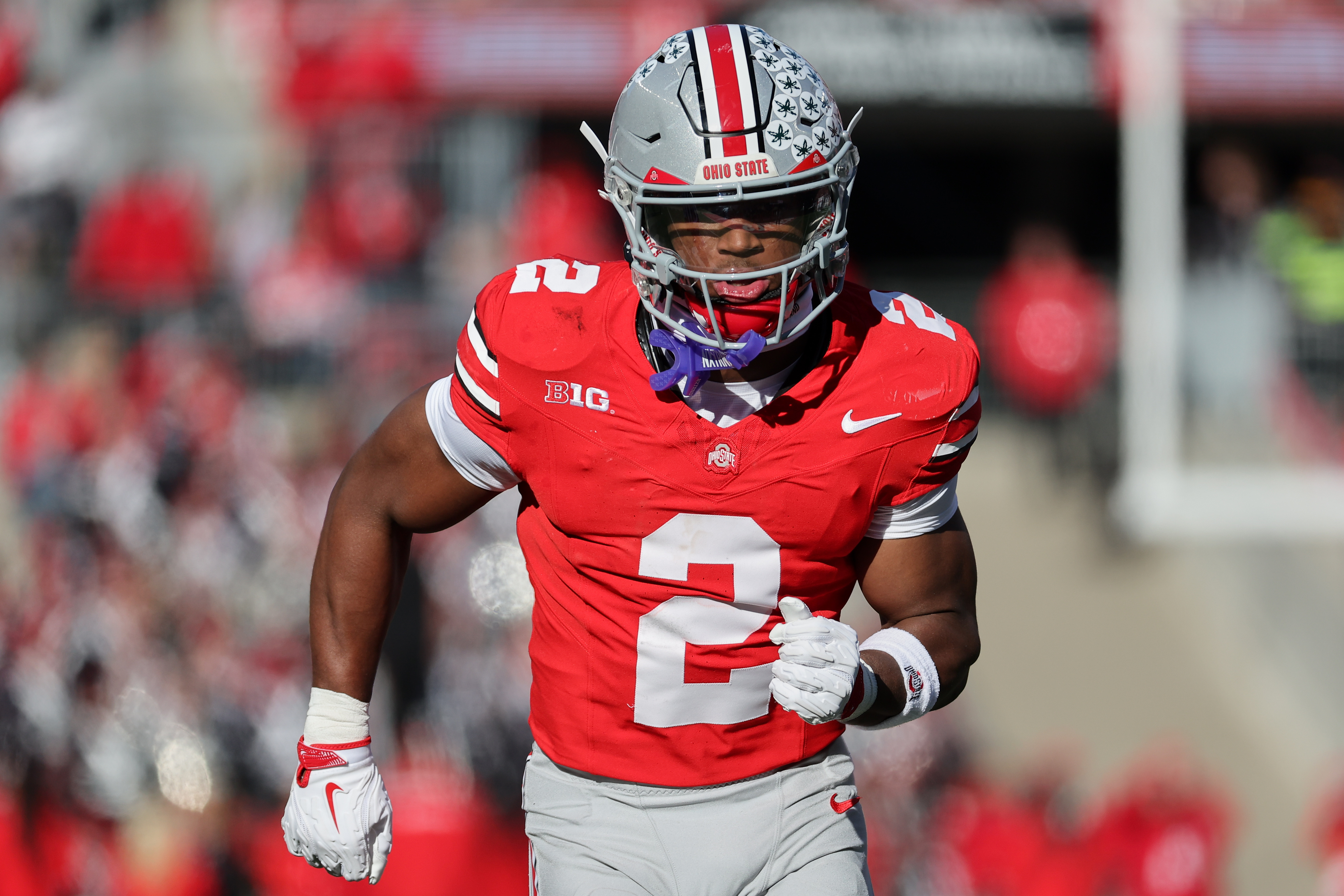 Ohio State Buckeyes safety Caleb Downs (2) runs as we break down our NFL Draft prediction markets.
