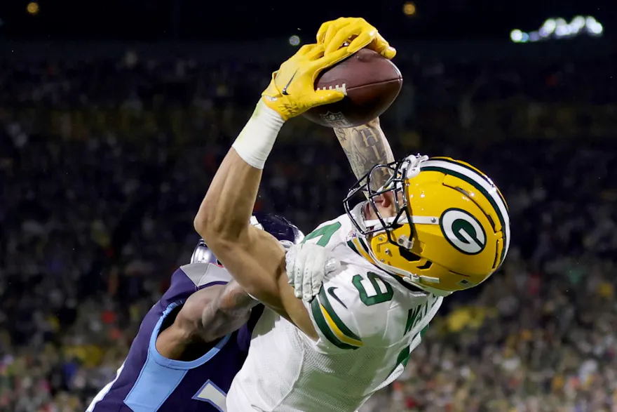 Christian Watson of the Green Bay Packers scores a 14 yard touchdown against Kristian Fulton of the Tennessee Titans at Lambeau Field on Nov. 17, 2022 in Green Bay, Wisconsin.