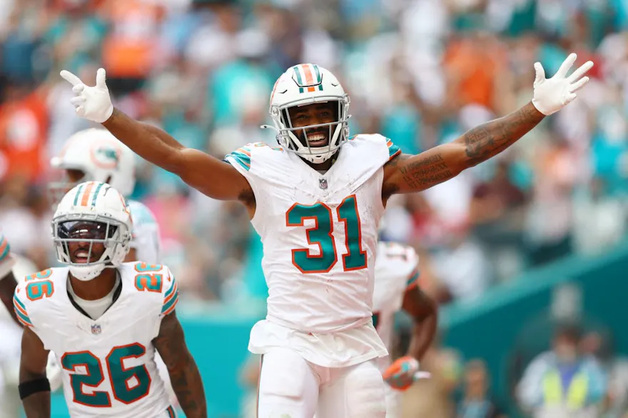Raheem Mostert of the Miami Dolphins celebrates after his rushing touchdown during the third quarter against the New England Patriots as we look at our Dolphins-Jets prop predictions for Black Friday.